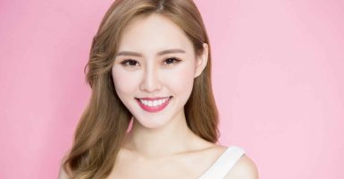 beauty skincare woman smile to you on the pink background